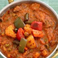 Vegetable Kadai (Vegan) · Seasonal vegetable cooked with chunks of onion, bell pepper and tomato with Indian spices.