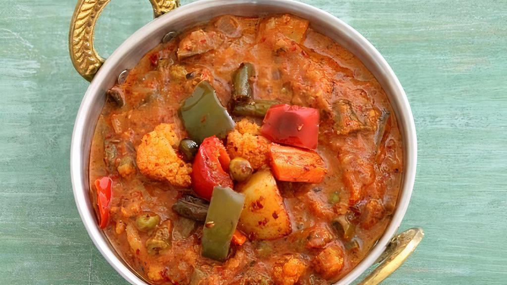 Vegetable Kadai (Vegan) · Seasonal vegetable cooked with chunks of onion, bell pepper and tomato with Indian spices.
