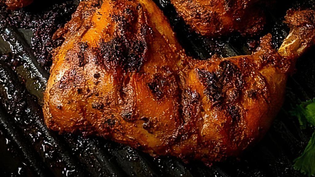 Tandoori Chicken (4 Pieces) · Chicken with bone, marinated in yogurt, ginger and freshly ground spices, skewered and grilled to perfection.