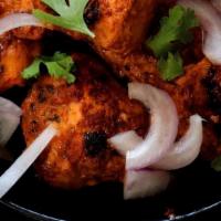 Chicken Tikka Kabab · Boneless cubes of chicken marinated in ginger, garlic, yogurt and Indian spices cooked in cl...