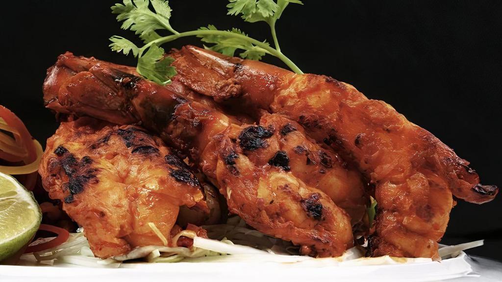 Tandoori Shrimp · Shrimp marinated in a exotic blend of Indian spices, then cooked on a skewer in the tandoor.