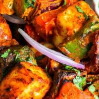 Paneer Kabab · Farmer cottage cheese, green peppers and onions marinated overnight with spices cooked in a ...