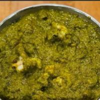 Shrimp Saag · Shrimp cooked with fresh spinach and a blend of Indian spices.