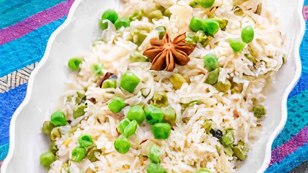 Jeera / Peas Pulao · Long grain basmati rice cooked with fresh green peas and saffron or cumin.