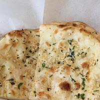Garlic Basil Naan · White flour bread topped and baked with fresh garlic and fresh basil.