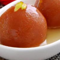 Gulab Jamun (2 Pcs) · Soft delicious berry sized balls made of milk solids, flour and leavening agents soaked in r...