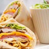 Cheesy Turkey Bacon Wrap · Rich, gooey Cheese, crispy turkey bacon, mixed greens, and your favorite toppings filled in ...