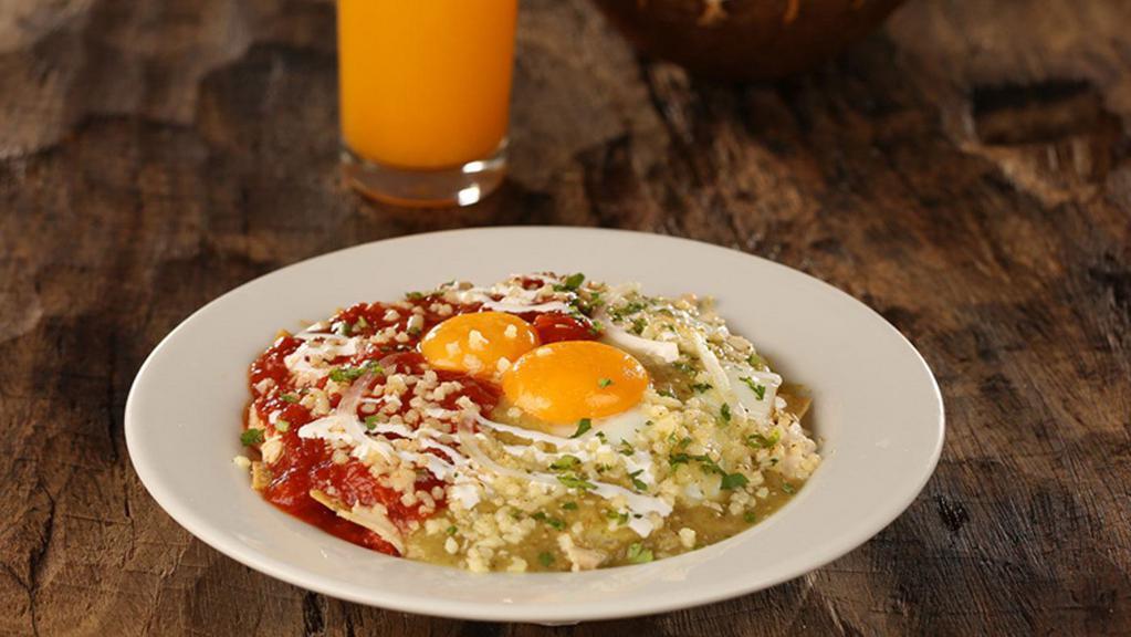 Chilaquiles · Fried eggs served with shredded chicken, crispy tortilla chips, melted mozzarella, sour cream, onion and cilantro.  Accompanied with your choice of tomatillo based salsa verde, ranchera sauce, or divorciados with a mix of both.