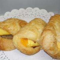 Savory Breakfast Croissants · Choice of egg and cheddar; sausage egg and cheddar; bacon egg and cheddar; or ham egg and ch...
