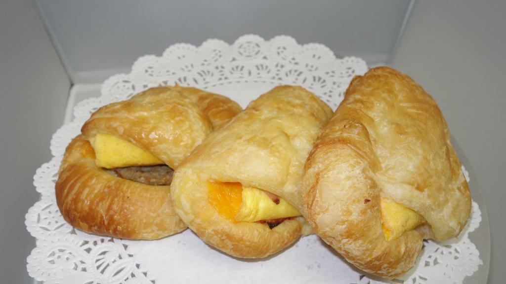 Savory Breakfast Croissants · Choice of egg and cheddar; sausage egg and cheddar; bacon egg and cheddar; or ham egg and cheddar.
