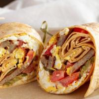 Scrambled Egg Wrap · Three eggs scrambled with diced tomatoes, choice of cheese, choice of bacon or sausage and c...