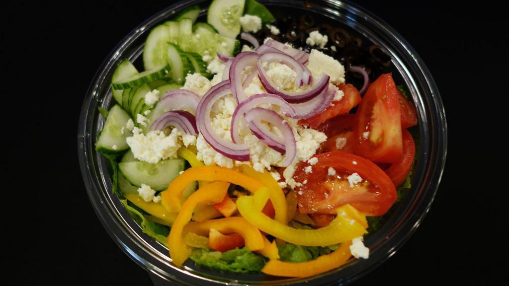 Greek Salad · Romaine lettuce, crumbled feta cheese, red onion, black olives, peppers, tomato, cucumber, and Greek dressing.