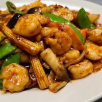Szechuan Shrimp · Shrimp, baby corn, water chestnuts, pea pods, straw mushrooms, carrots, bamboo shoots in a s...