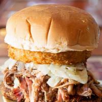 Sweeney'S Southern Pulled Pork Sandwich · A toasted Roma bun layered with pulled pork, onion ring, and topped with vinegar based coles...