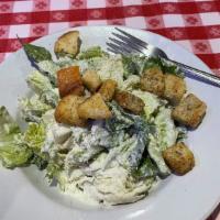 Caesar Salad · Freshly chopped hearts of romaine and seasoned home-style croutons tossed with our house mad...