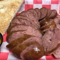 Sausage Platter · Over a half pound of smoked Krizman's sausage and two sides of your choice.