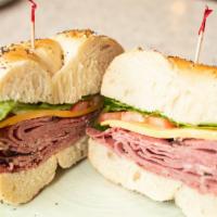 Roast Beef · Served with lettuce, tomato and onions on a bagel, roll, white, wheat or rye bread, with a p...