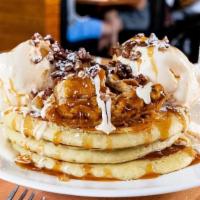 Sweet Apple Pie Pancakes · Buttermilks baked with walnuts and raisins and topped with apple cinnamon compote.
