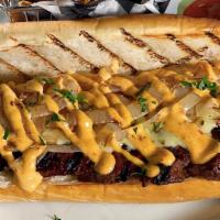 Churrasco Steak Sandwich · Our marinated skirt steak with caramelized onions, drizzled with chipotle aioli, served on a...
