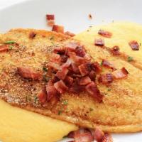 Fish N Grits · Creamy yellow stone grits with 2 fried fish fillets.