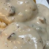 Biscuits & Gravy Platter · Two biscuits smothered in cream or sausage gravy, two eggs any style with your choice of mea...