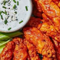Buffalo Mild Chicken Wings · 6 bone-in buffalo mild chicken wings. Served with celery, carrots and blue cheese or ranch d...