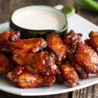Honey Bbq Wings · 6 bone-in honey BBQ chicken wings. Served with celery, carrots, and blue cheese or ranch dre...