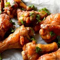 Thai Curry Chicken Wings · 6 bone-in thai curry chicken wings. Served with celery, carrots, and blue cheese or ranch dr...