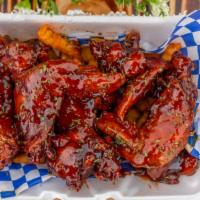 Jack Daniels Or Bourbon Wings · Wings are marinated for 48 hours in our signature sauces, then Deep Fried & toss in either J...