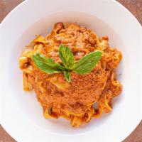 Fettuccine Bolognese · Ground beef sautéed in a creamy in a creamy rose sauce. Served over egg fettuccine.
