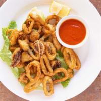 Fried Calamari · Lightly dusted and deep-fried to a golden brown. Served with lemon and a side of tomato sauce.