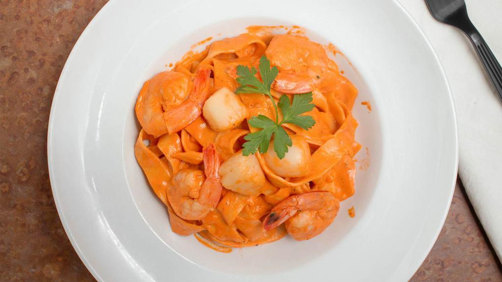 Fettuccine Shrimp & Scallops · Jumbo shrimp and scallops in a creamy rose sauce.