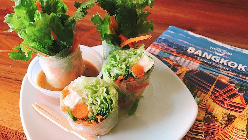 Fresh Spring Rolls · (Vegan, Gluten Free). Lettuce, mint, carrot, cucumber, and cilantro wrapped in soft rice paper with your choices of Tofu or Shrimp. Served with peanut sauce. (4 Rolls)
