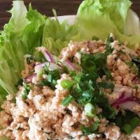 Larb Salad · Minced chicken or beef mixed with red onion, cilantro, mint, rice powder, scallions, and chi...