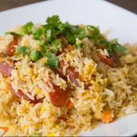 Sausage Fried Rice · Jasmine rice stir-fried with egg. Thai sausage, peas, carrots, and onion. Fried rice dishes ...