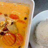 Massaman Curry · (Hot, Spicy, Gluten Free, Dairy Free). Potatoes, carrots, onions, and peanuts in massaman cu...