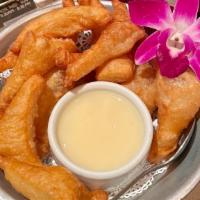 Thai Donuts · Crispy Thai Donuts style served with condensed milk.