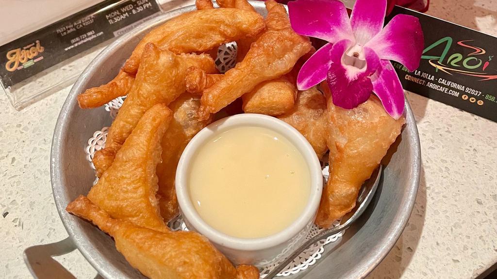 Thai Donuts · Crispy Thai Donuts style served with condensed milk.