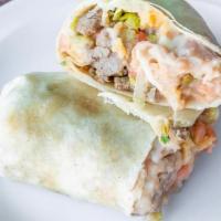 Burrito - Large · Soft Flour Tortilla packed with Meat, Yellow Rice, Beans, Onion, Cilantro, Lettuce, Tomato, ...