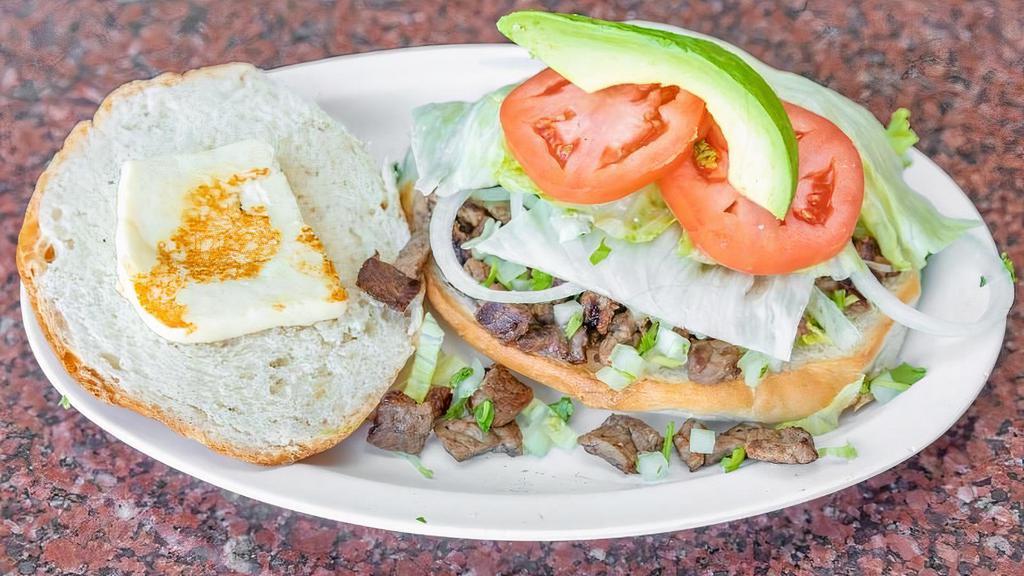 Torta · Sandwich served on a Mexican style Telera roll with your choice of Meat, Refried Beans, Onion, Cilantro, Letttuce, Tomato, Queso Blanco and Avocado!