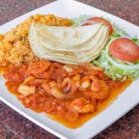 Spicy Shrimp · A dozen Shrimp tossed in a spicy Chipotle sauce and sautéed with Onions served with (5) Corn...