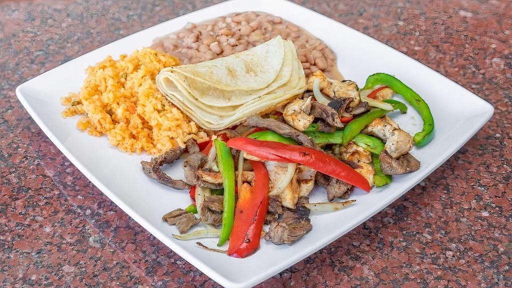 Fajitas · Your choice of up to two types of Meat sliced and grilled with Onions, Red & Green Peppers served with (5) Corn Tortillas and (2) Sides