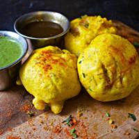 Batada Vadas · 3 chickpea batter fried fritters stuffed with spiced mashed potato. Served with sweet tamari...