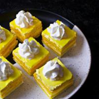Mango Cream Cake · Vanilla sponge cake between layers of velvety mango cream.