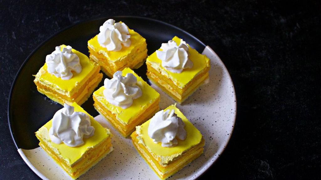 Mango Cream Cake · Vanilla sponge cake between layers of velvety mango cream.