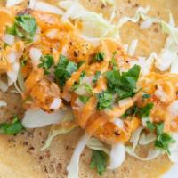 Chipotle Shrimp · Spicy Chipotle sauce, cabbage, onion & cilantro