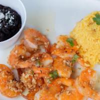 Al Mojo De Ajo Shrimp (Sauteed Garlic) · Served with tortillas, rice and black beans.