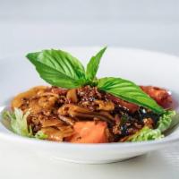 Pad Kee Mow · Spicy. rice noodle, chili black soy, Thai basil, egg, red bell pepper, tomato, romaine lettu...