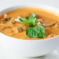 Red Curry · Spicy. Red curry, coconut milk, bamboo shoot, Thai basil, red bell pepper. Served with jasmi...