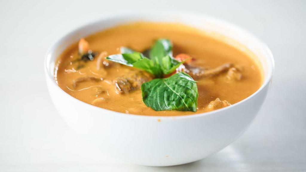 Red Curry · Spicy. Red curry, coconut milk, bamboo shoot, Thai basil, red bell pepper. Served with jasmine white rice.